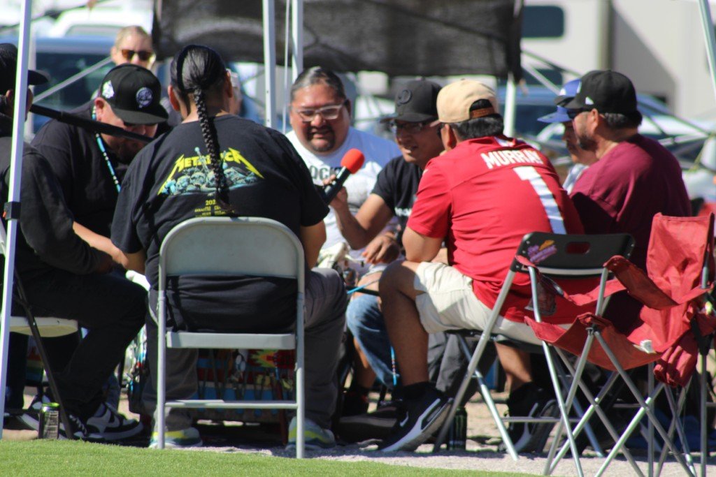 Snow Mountain Paiute Pow Wow Grand Entry - a drum crew member  takes the microphone to render his best wild burro call.