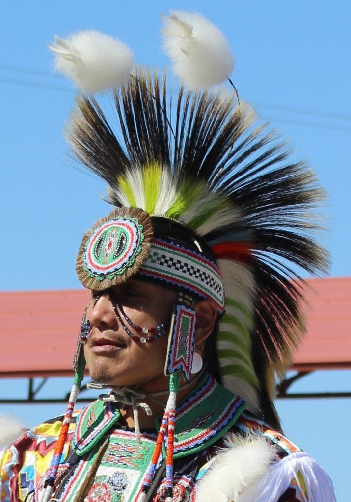 Snow Mountain Paiute Pow Wow Grand Entry - a man adorned in a Men's Traditional enjoys a moment.