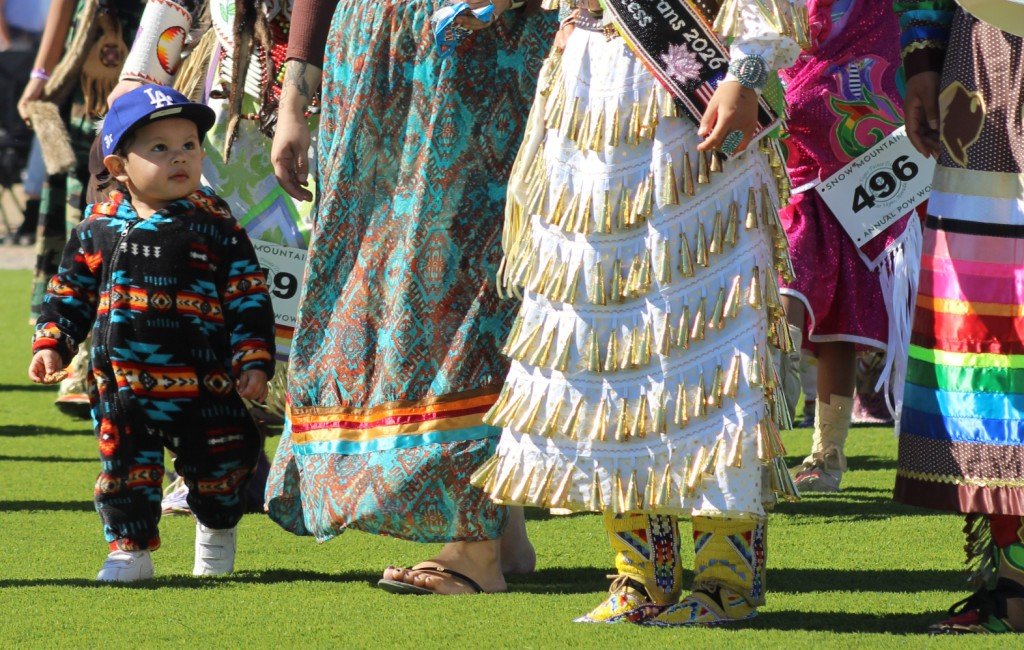 Snow Mountain Paiute Pow Wow Grand Entry - a small child watches his mother and sister.