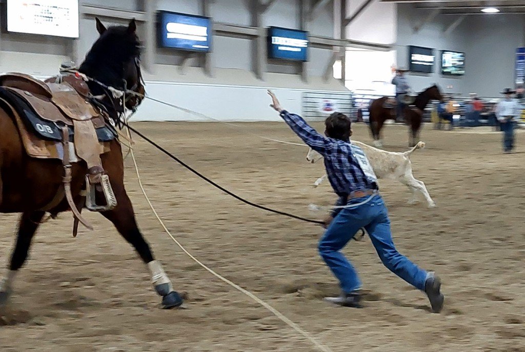 Breakaway event, male contestant struggles to control his calf during time trials during time trials at Priefert Pavilion as seen at: Priefert Pavilion; South Point Arena; South Point; and Horseman’s Park.