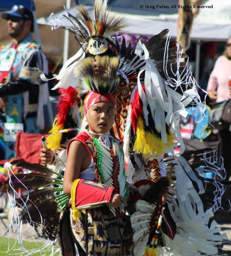 Snow Mountain Paiute Pow Wow at end of Grand Entry as young performer is startled as seen in powwows: Duck Valley; Elko; Ely; Fallon; Fort Mojave; Goshute; Las Vegas; Snow Mountain; Las Vegas Snow Mountain; Las Vegas Paiute Tribe; Las Vegas Snow Mountain Paiute; Las Vegas Snow Mountain Paiute Tribe; 33rd annual Las Vegas Snow Mountain Paiute; Moapa; Muckleshoot; Nevada Day; Numaga; Pahrump; Pahrump Valley; Pahrump Valley Social; Pahrump Social; Petrack; Petrack Park; Red Dress; Sacred Visions; Stewart; Sycuan; UNLV; UNR; Univ. of Nev. Reno; and Walker River.