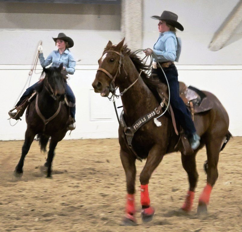 In team roping event, two cowgirls admit defeat in time trials at Priefert Pavilion as seen in high school rodeos: Alamo; Battle Mountain; Boulder City; Pahrump; Pahrump Valley; Elko; Eureka; Fallon; Fernley; Humboldt; Moapa Valley; Spanish Springs; Washoe; Wells; White Pine; NSHSRA; Priefert Pavilion; & South Point.