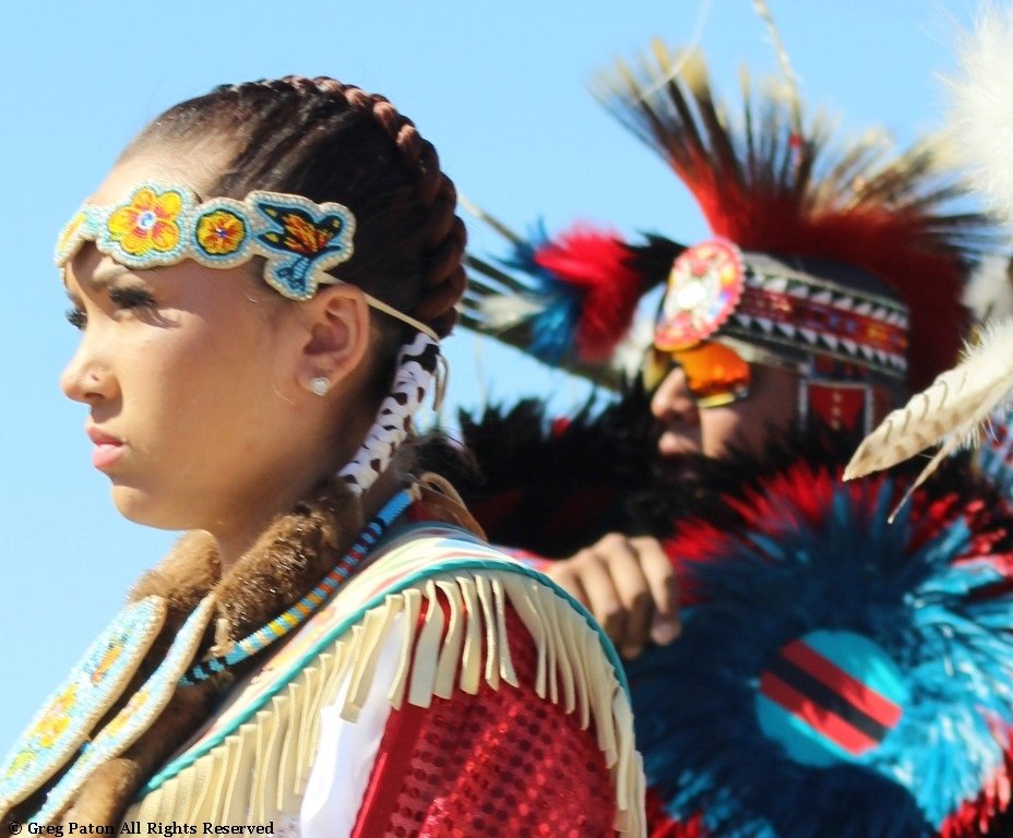 Closeup of young Native American in the Grand Entry as seen in powwows: Chippewa; Choctaw; Choctaw Nation; Comanche; Crow; Dakota; Haudenosaunee; Hopi; Iroquois; and Iroquois Confederacy.