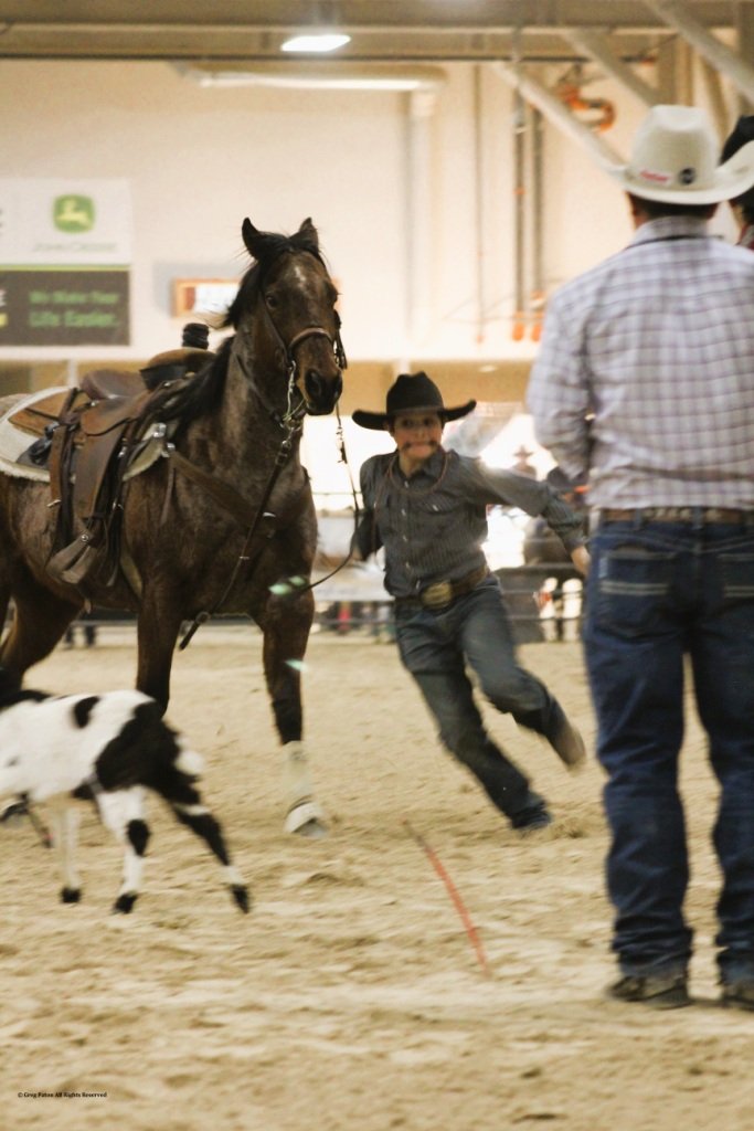 In goat tie-down event, cowboy tracks goat as official watches in time trials at Priefert Pavilion as seen in high school rodeos: Alamo; Battle Mountain; Boulder City; Pahrump; Pahrump Valley; Elko; Eureka; Fallon; Fernley; Humboldt; Moapa Valley; Spanish Springs; Washoe; Wells; White Pine; NSHSRA; Priefert Pavilion; & South Point.